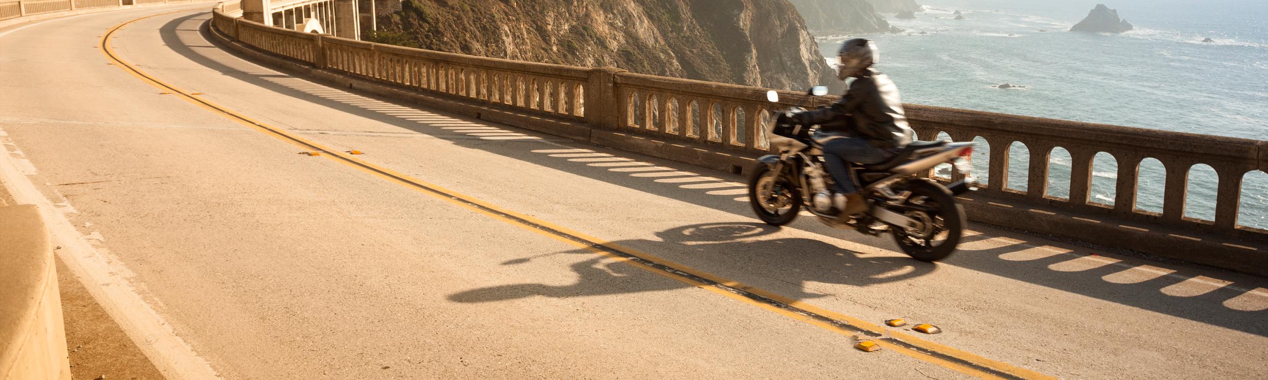 motorcycle riding along the coast